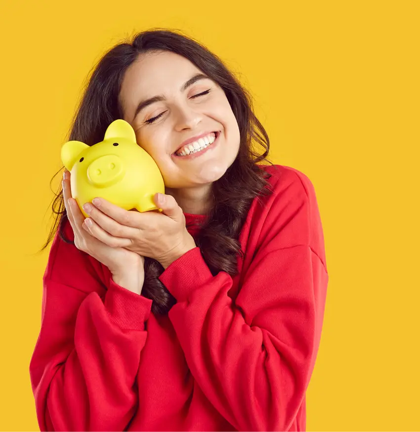 Smiling woman with piggy bank symbolizing savings